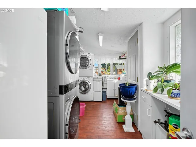 a view of residential houses with outdoor space and ocean view