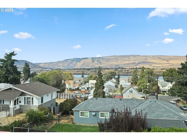 a view of a patio with table and chairs and potted plants