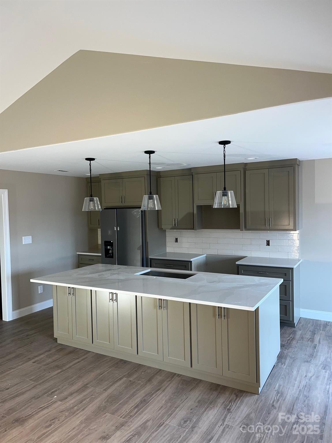 110 Alf Hoover Road Lincolnton, NC 28092 - Photo 14 of 35 a large kitchen with stainless steel appliances a large counter top a stove and a sink
