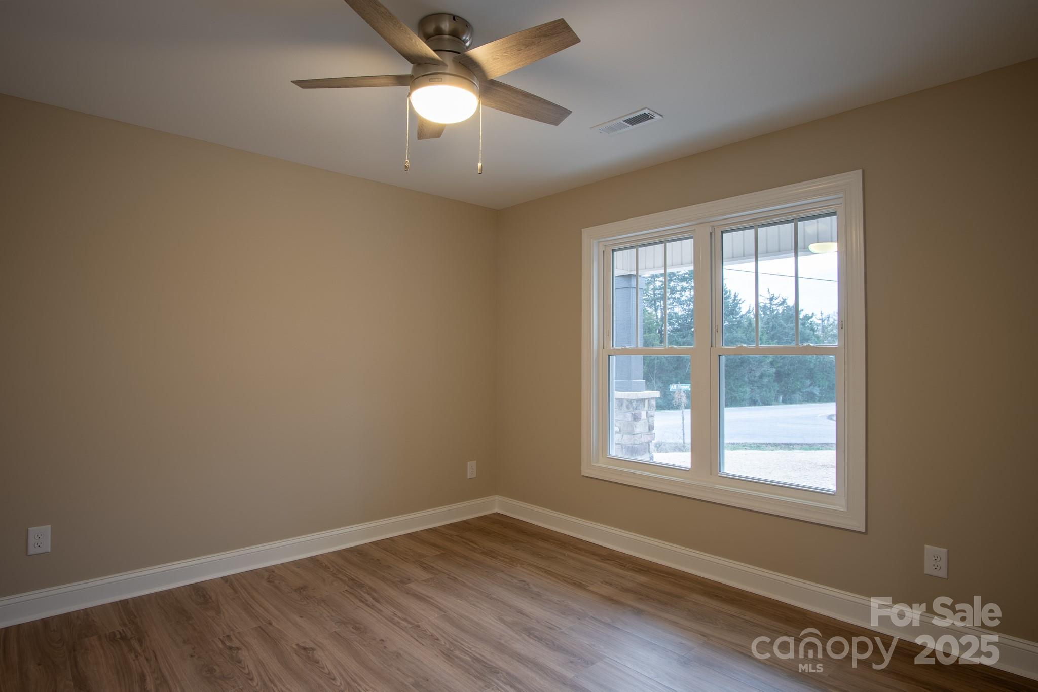 110 Alf Hoover Road Lincolnton, NC 28092 - Photo 17 of 35 wooden floor in an empty room with a window