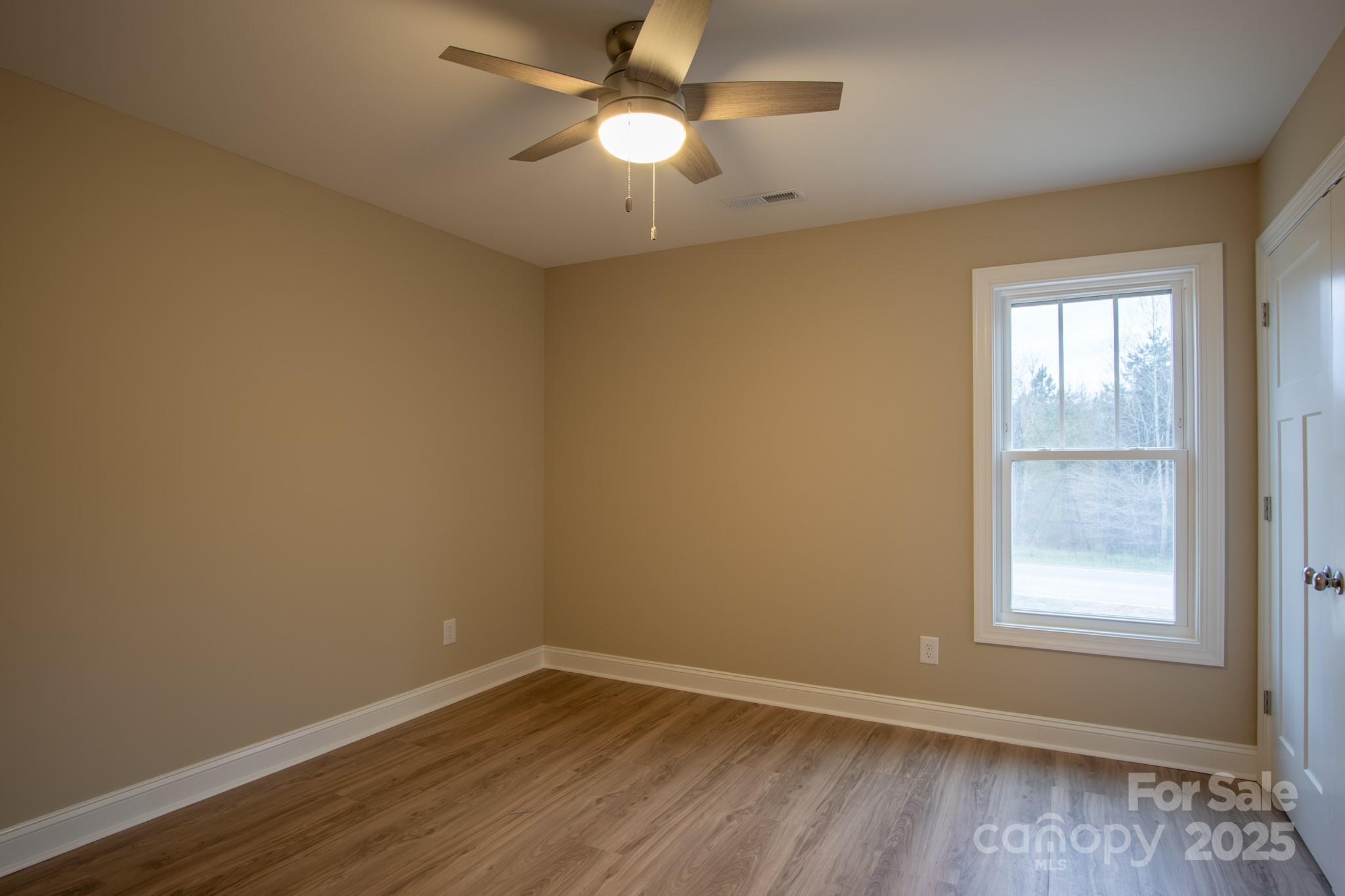 110 Alf Hoover Road Lincolnton, NC 28092 - Photo 19 of 35 wooden floor in an empty room with a window