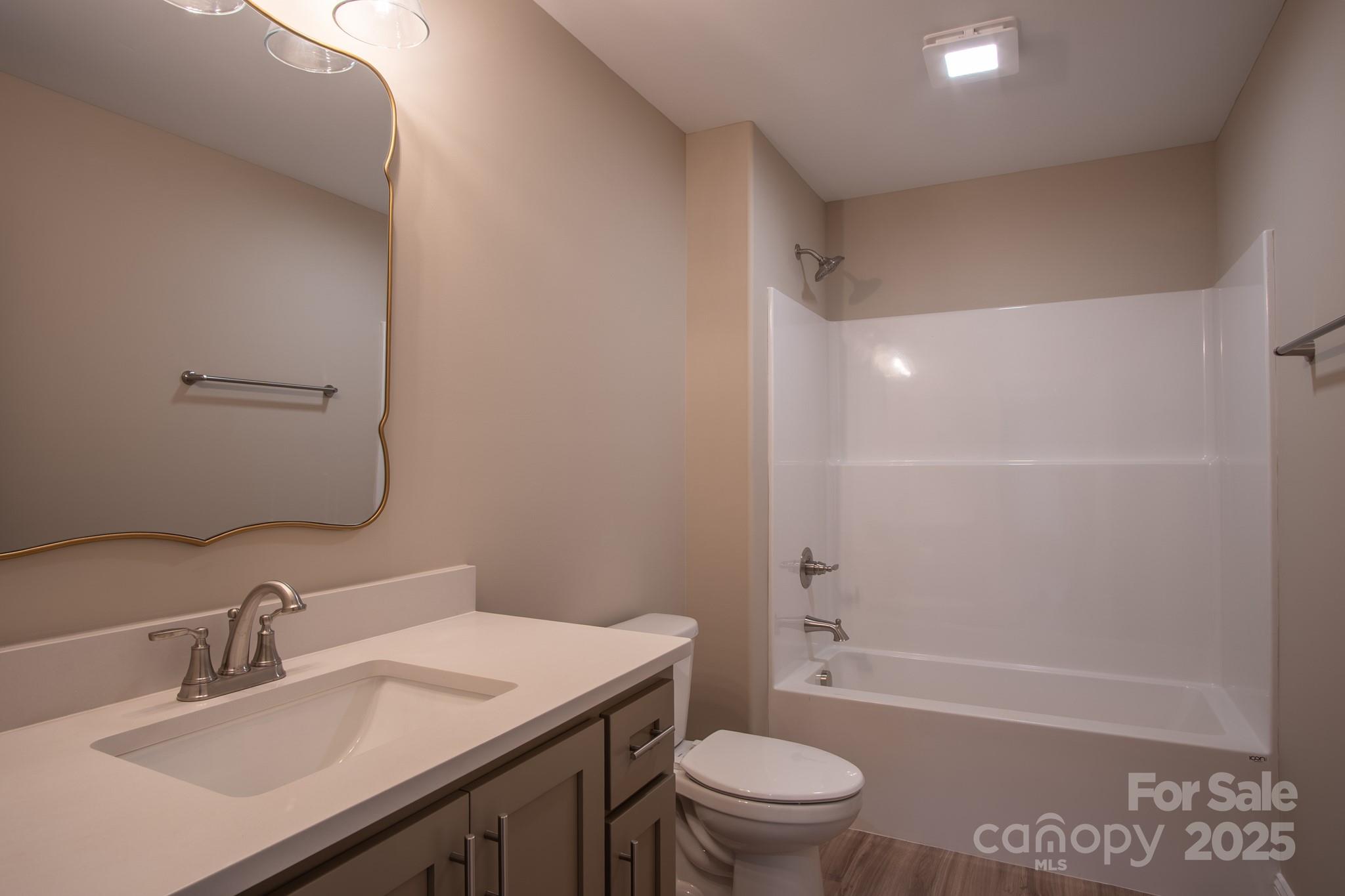 110 Alf Hoover Road Lincolnton, NC 28092 - Photo 21 of 35 a bathroom with a sink toilet vanity and shower