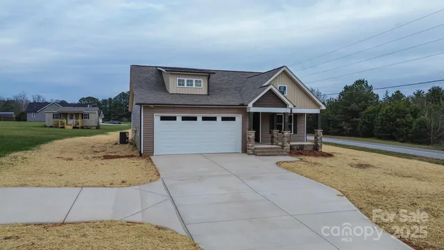 a view of house with outdoor space and sitting area