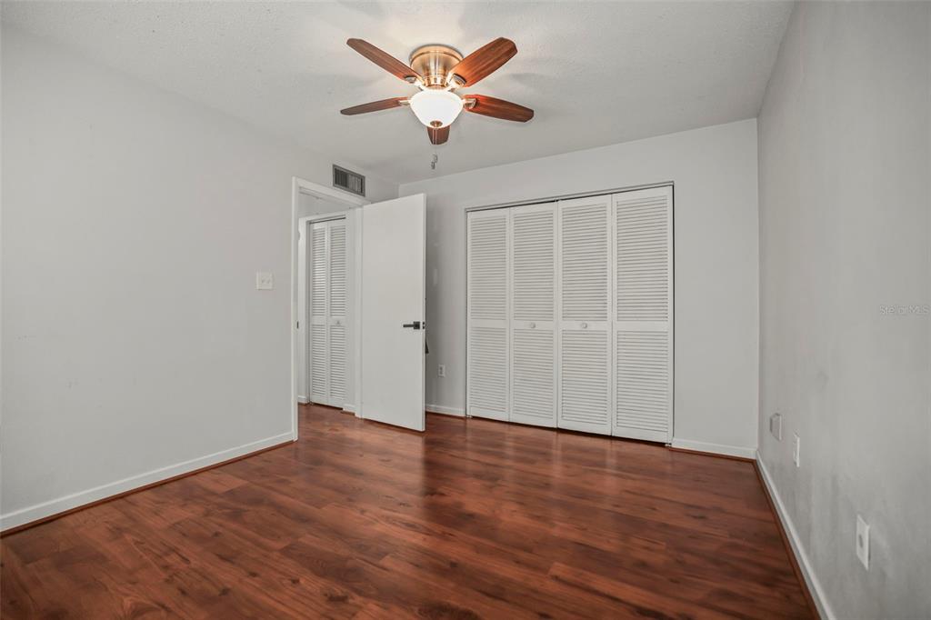 11655 3rd Street East, Unit 19 Treasure Island, FL 33706 - Photo 16 of 48 wooden floor in an empty room