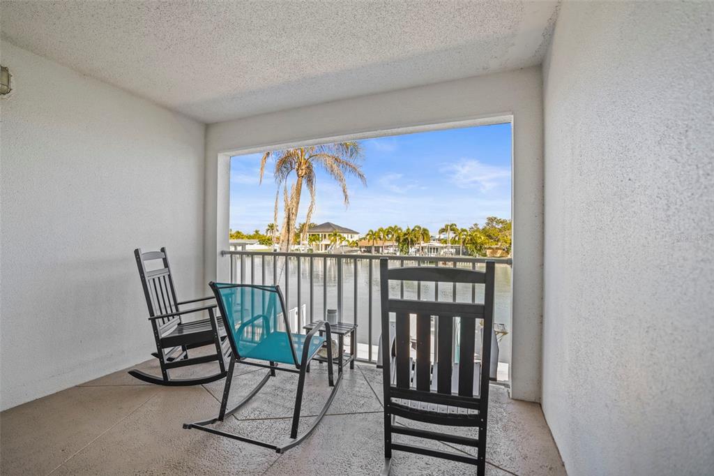 11655 3rd Street East, Unit 19 Treasure Island, FL 33706 - Photo 21 of 48 a view of a chair in a balcony