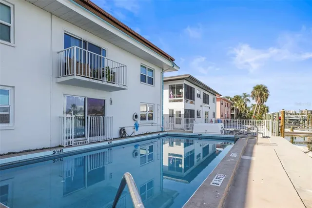 a view of a lake with couches and city view