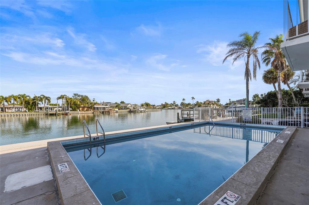 11655 3rd Street East, Unit 19 Treasure Island, FL 33706 - Photo 27 of 48 a view of a lake with couches and city view