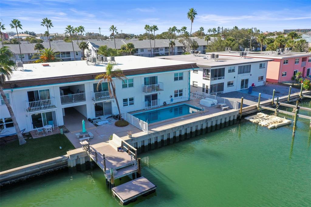11655 3rd Street East, Unit 19 Treasure Island, FL 33706 - Photo 28 of 48 aerial view of a house with a swimming pool patio and lake view