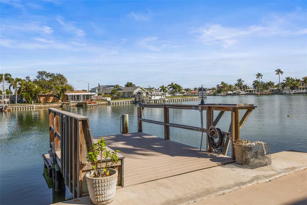11655 3rd Street East, Unit 19 Treasure Island, FL 33706 - Photo 30 of 48 a terrace with outdoor seating and city view