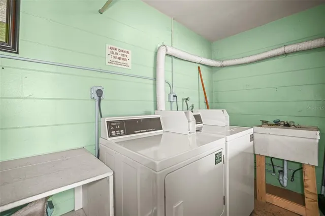 a view of a hallway with white doors