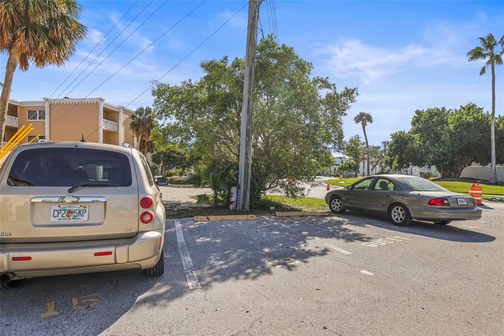 11655 3rd Street East, Unit 19 Treasure Island, FL 33706 - Photo 32 of 48 a view of a car parked in front of a house