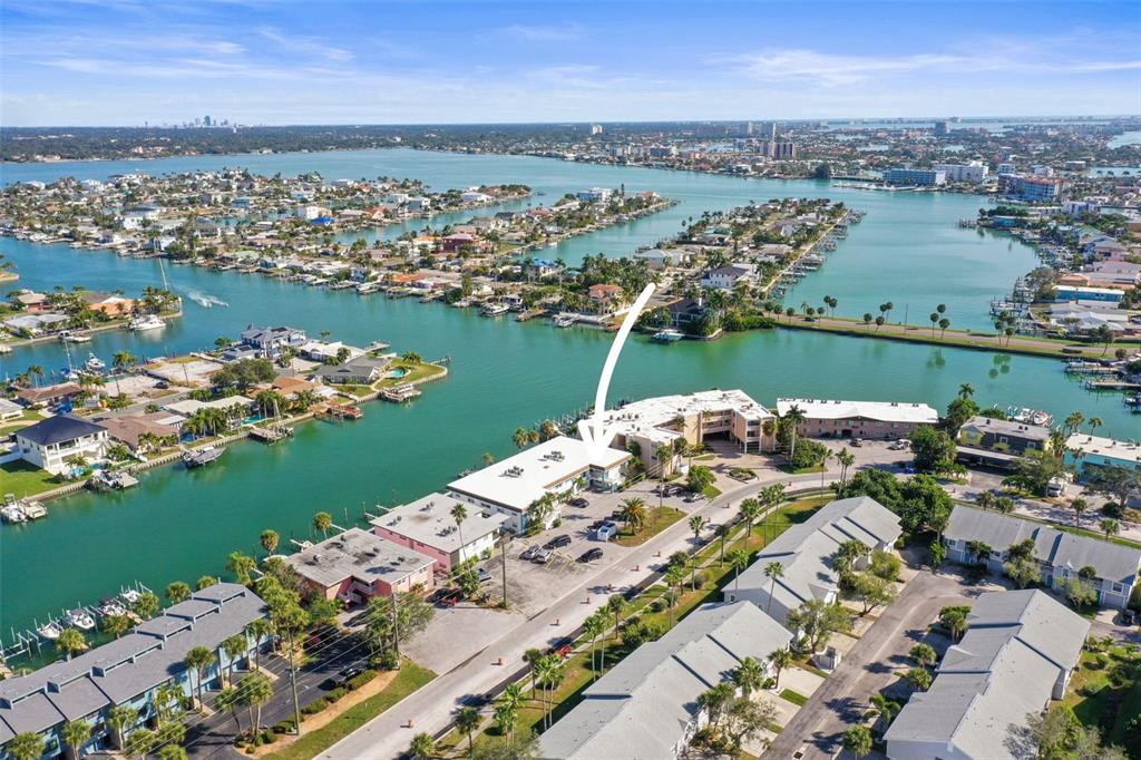 11655 3rd Street East, Unit 19 Treasure Island, FL 33706 - Photo 44 of 48 an aerial view of a city with lots of residential buildings lake and ocean view