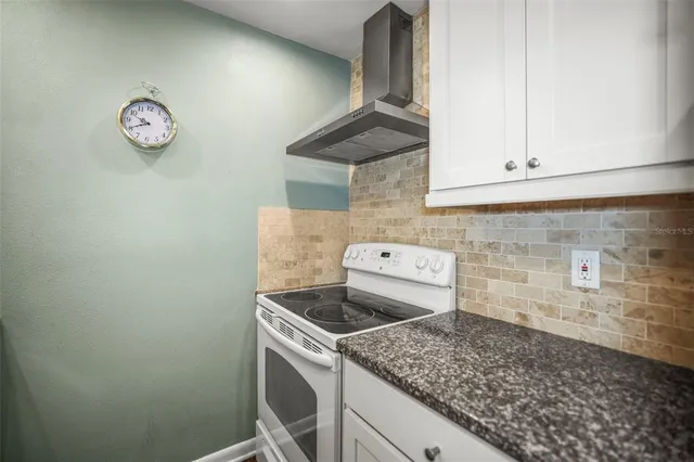 a view of a kitchen cabinets and wooden floor