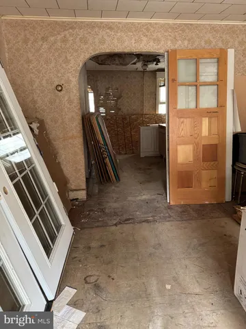 a view of an entryway with a kitchen