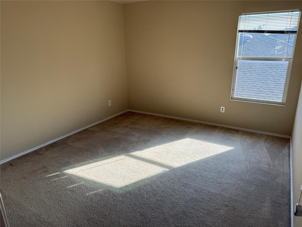 5718 Green Ivy Road Denton, TX 76210 - Photo 19 of 23 Unfurnished room featuring carpet and baseboards