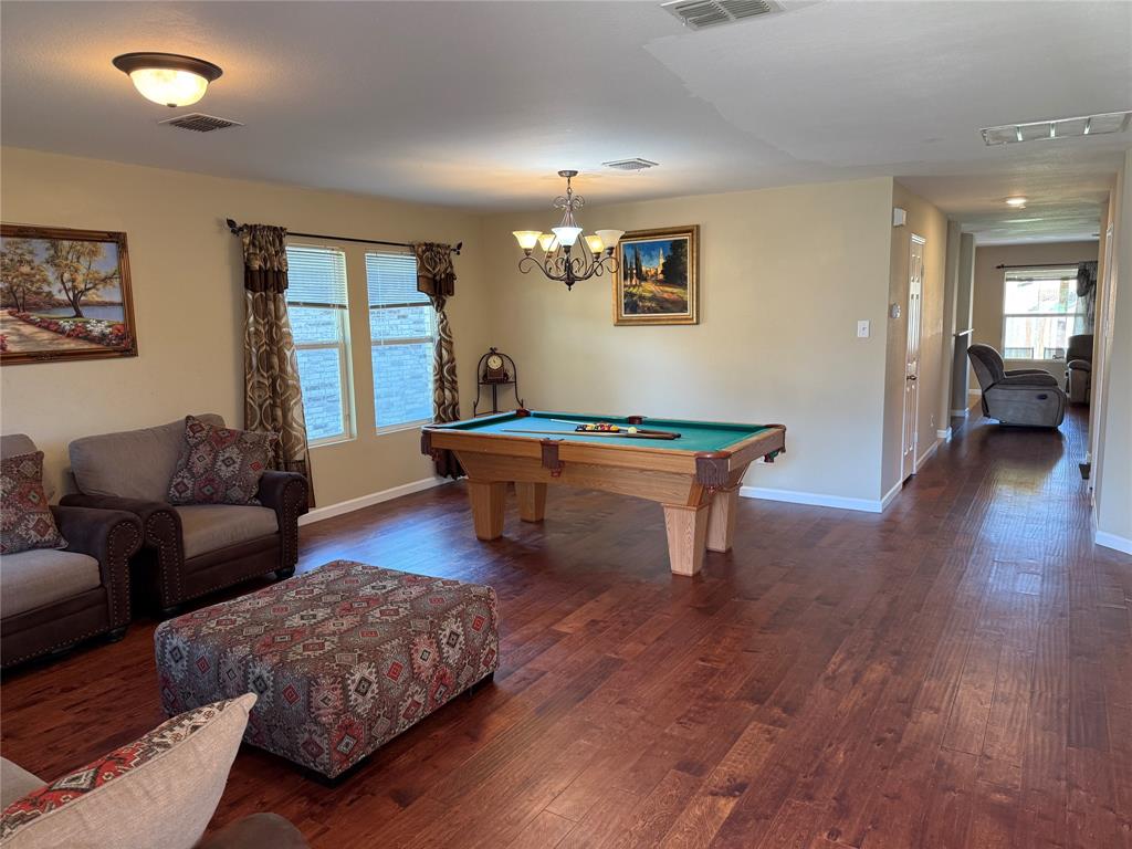 5718 Green Ivy Road Denton, TX 76210 - Photo 2 of 23 Playroom with billiards and dark wood finished floors