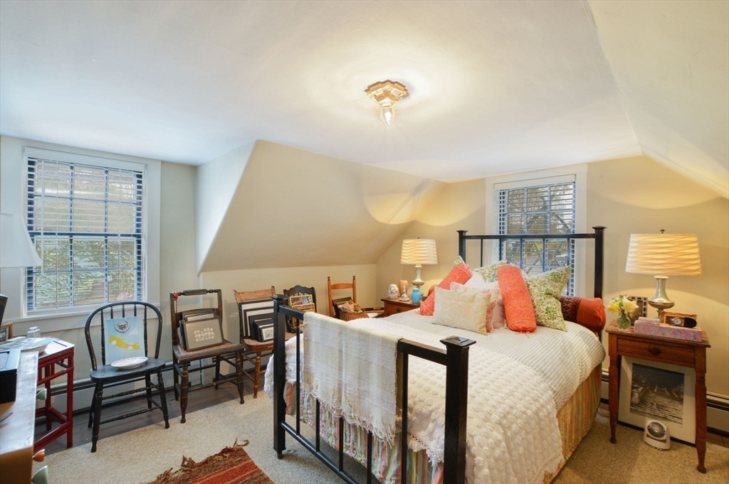 1150 Russells Mills Road Dartmouth, MA 02748 - Photo 13 of 31 a bedroom with a bed and a table in it