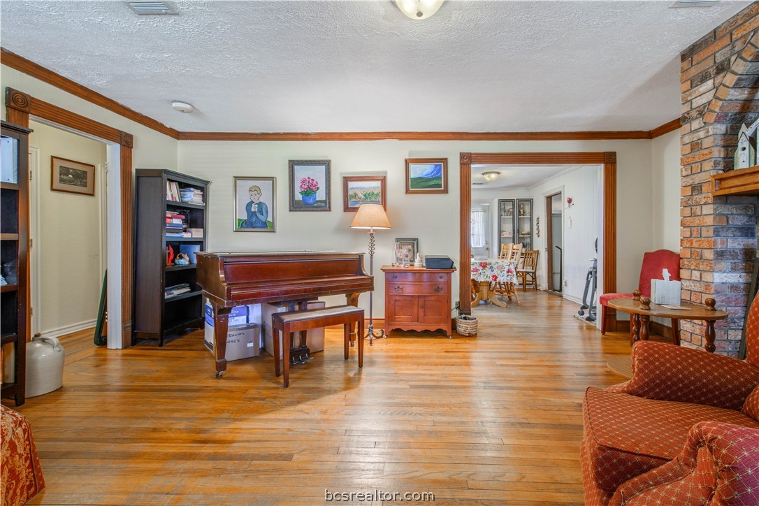 706 Edgemore Drive Bryan, TX 77802 - Photo 6 of 18 a living room with furniture and wooden floor