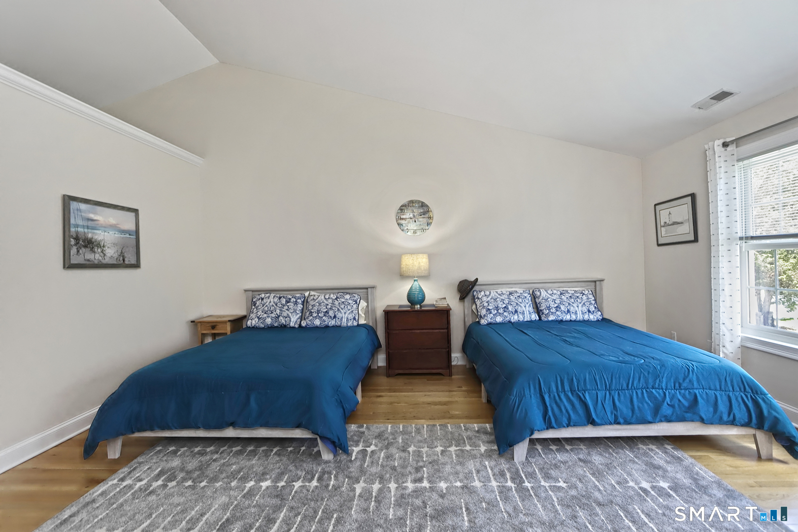 102 Lantern Court, Unit 102 Clinton, CT 06413 - Photo 31 of 36 a bedroom with a bed and window