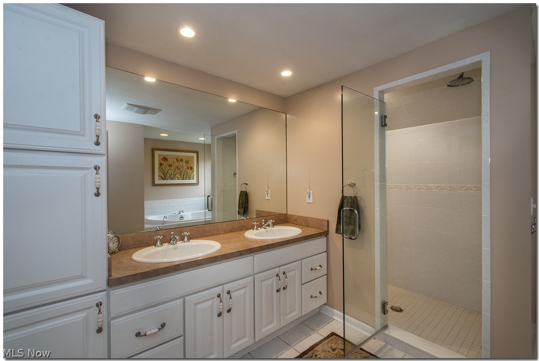 2987 Lander Road Pepper Pike, OH 44124 - Photo 16 of 33 Completely renovated Mast bath, w/aspen shaker cabinetry dble vanity, cust glass shower, rain drop shower head.