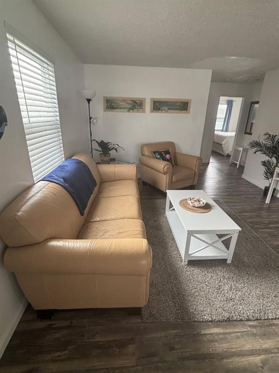 115 15th Avenue, Unit A Indian Rocks Beach, FL 33785 - Photo 15 of 65 a living room with furniture and wooden floor