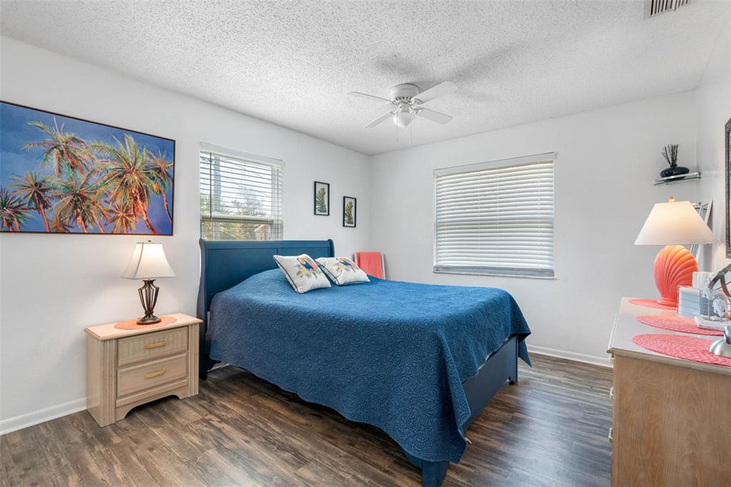 115 15th Avenue, Unit A Indian Rocks Beach, FL 33785 - Photo 17 of 65 a bedroom with a bed and a window