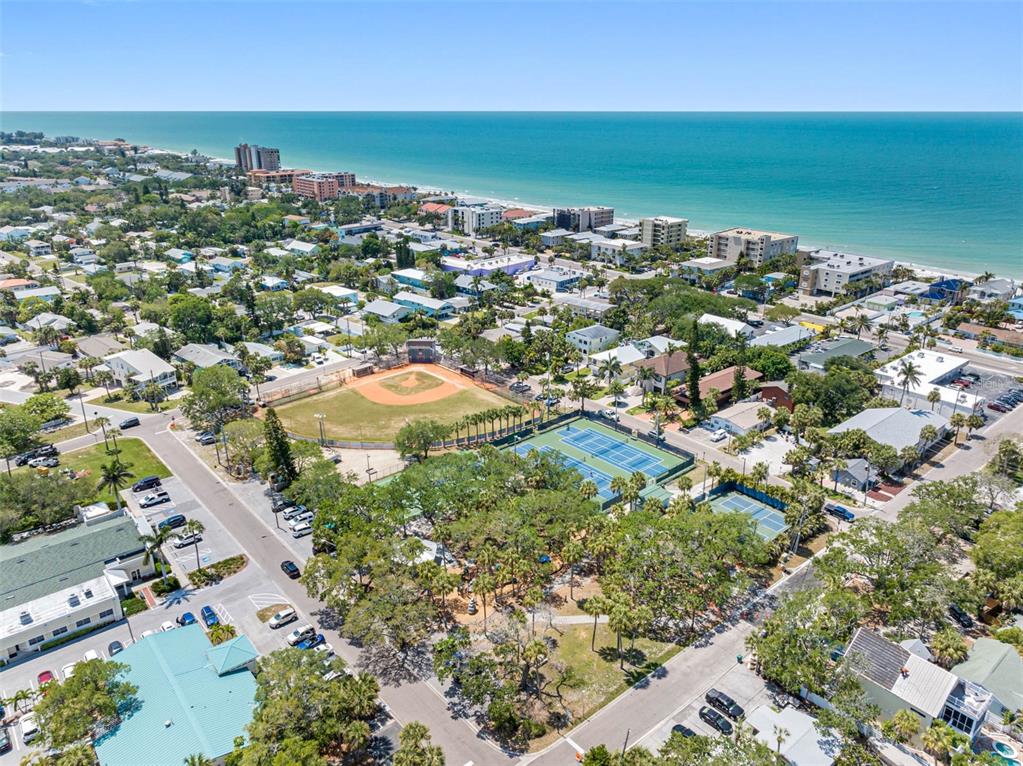 115 15th Avenue, Unit A Indian Rocks Beach, FL 33785 - Photo 48 of 65 an aerial view of residential houses with outdoor space and trees