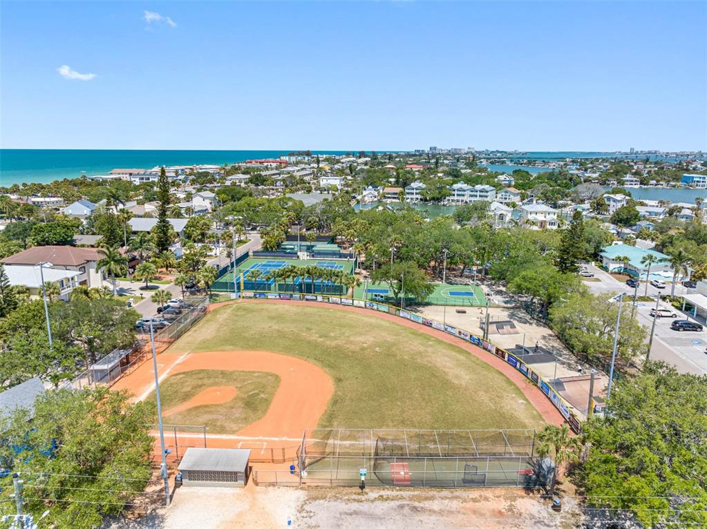 115 15th Avenue, Unit A Indian Rocks Beach, FL 33785 - Photo 56 of 65 an aerial view of residential houses with outdoor space