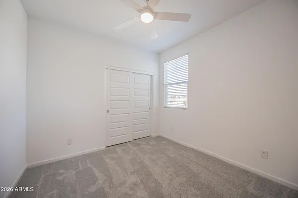an empty room with a empty space and a window