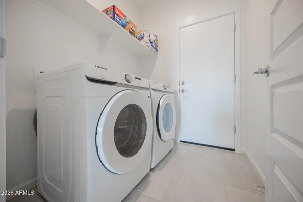a utility room with dryer and washer
