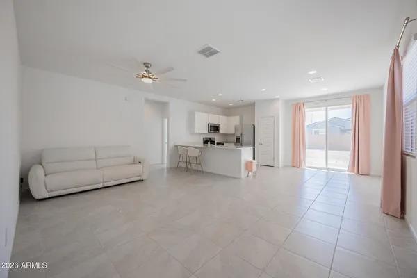 a living room with furniture and white walls
