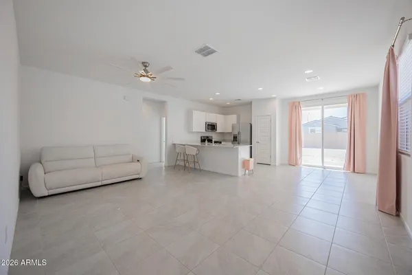 a living room with furniture and white walls