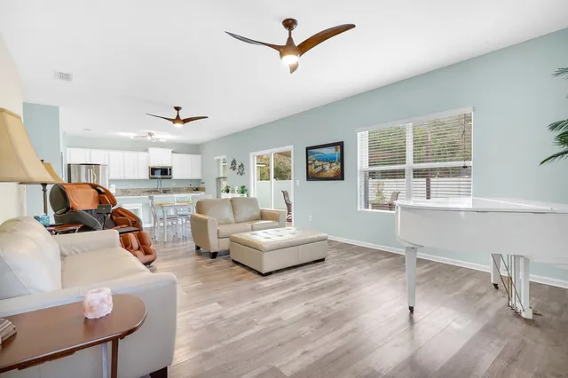 a living room with furniture and white walls