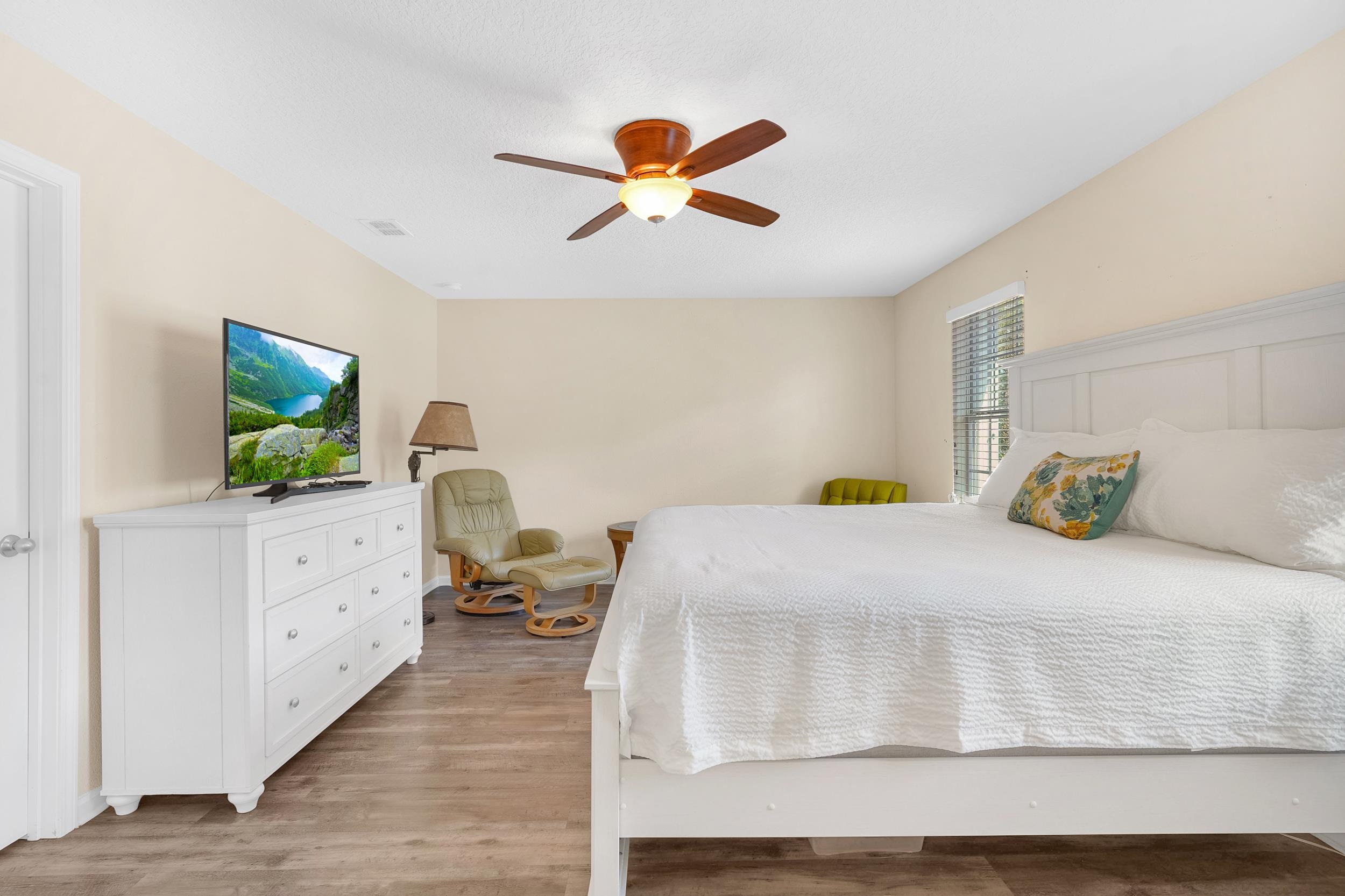 167 Codman Drive St. Augustine, FL 32084 - Photo 19 of 40 a bedroom with a bed and a chandelier