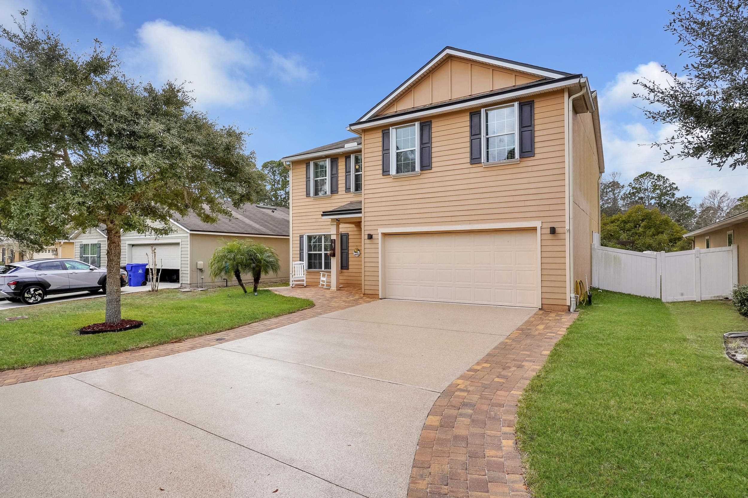167 Codman Drive St. Augustine, FL 32084 - Photo 2 of 40 a front view of a house with a yard and garage