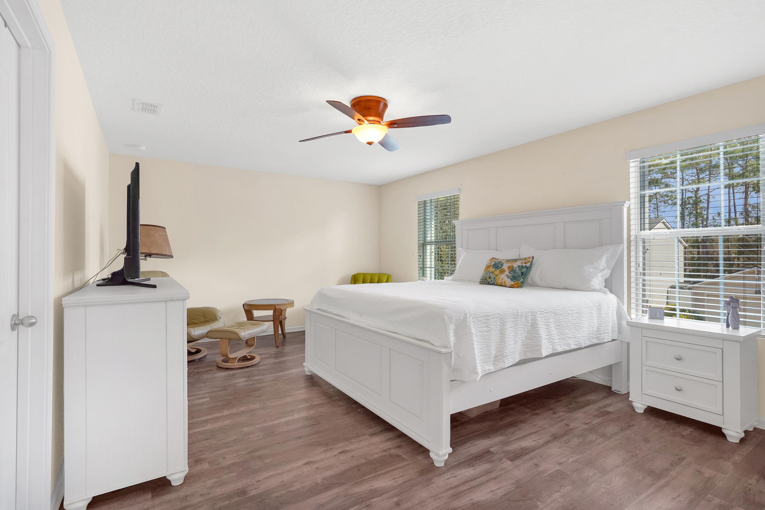 167 Codman Drive St. Augustine, FL 32084 - Photo 21 of 40 a spacious bedroom with a bed and a chandelier