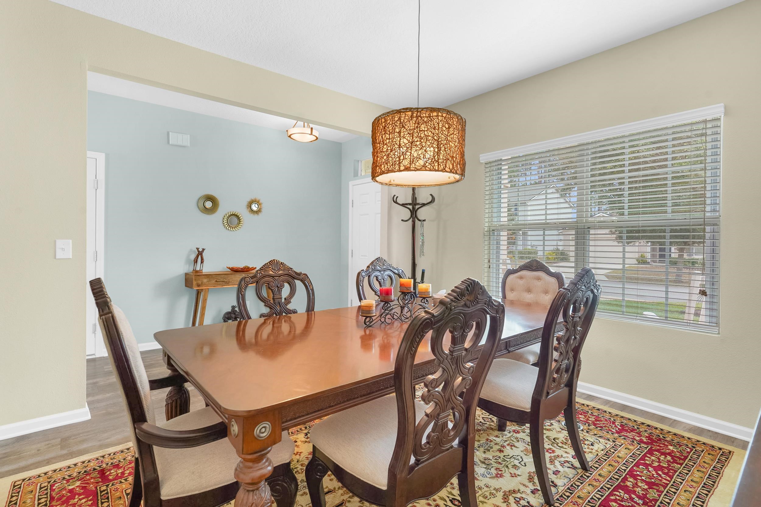 167 Codman Drive St. Augustine, FL 32084 - Photo 4 of 40 a view of a dining room with furniture window and wooden floor