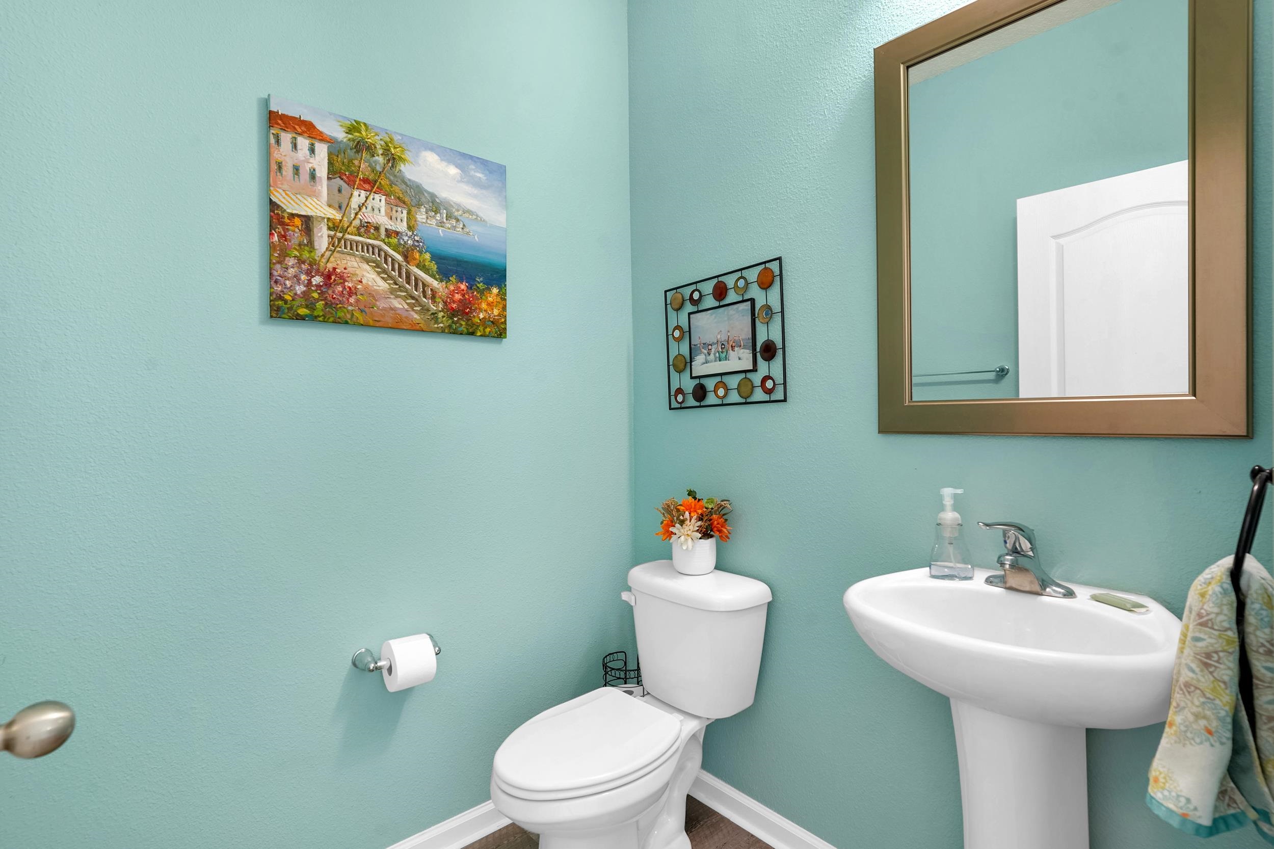 167 Codman Drive St. Augustine, FL 32084 - Photo 8 of 40 a bathroom with a toilet a sink and mirror