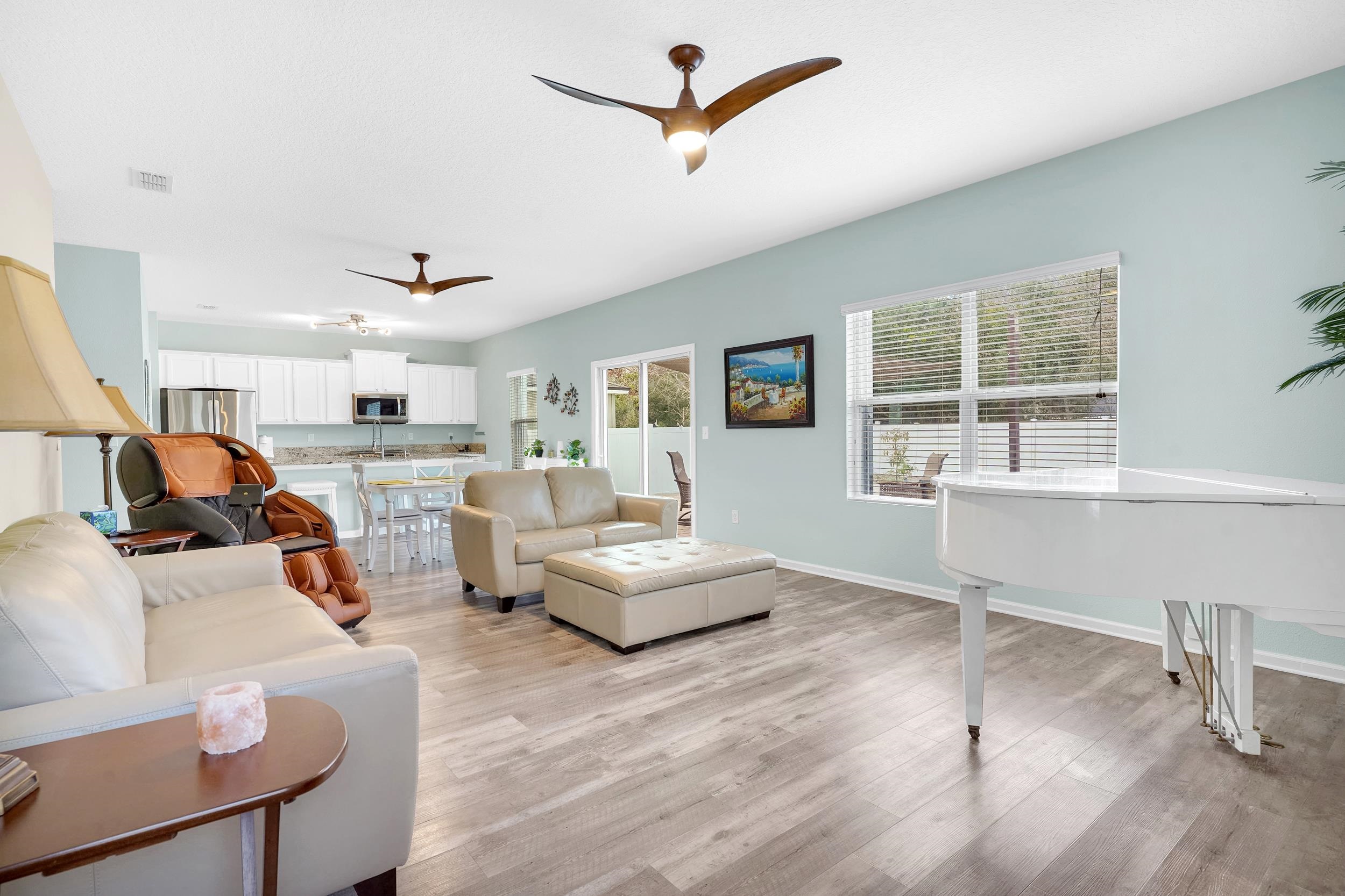 167 Codman Drive St. Augustine, FL 32084 - Photo 10 of 40 Living area featuring a ceiling fan and light wood-style flooring