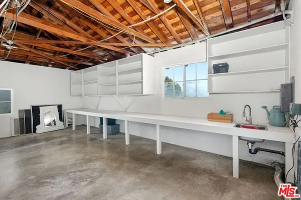 a storage room with table and chairs
