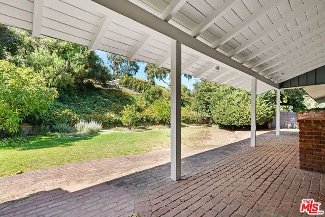 a view of a porch with wooden floor