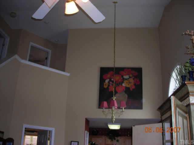9020 Shallcross Way Raleigh, NC 27617 - Photo 3 of 8 a painting on the wall next to a wall