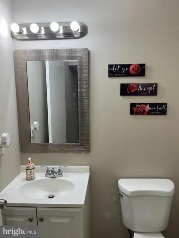 a view of a livingroom with furniture and stairs