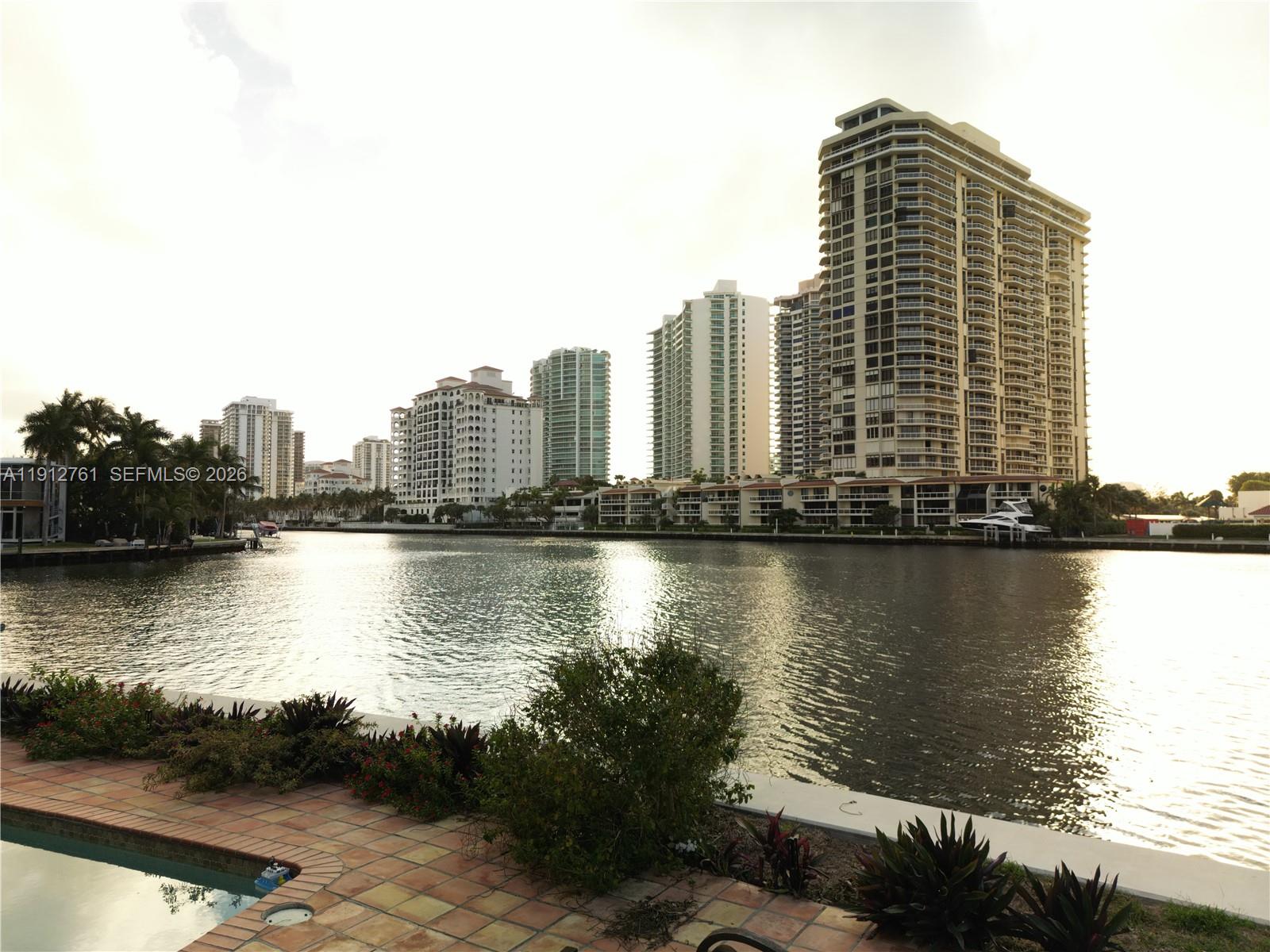 363 Centre Island Golden Beach, FL 33160 - Photo 15 of 31 a view of a lake with tall building