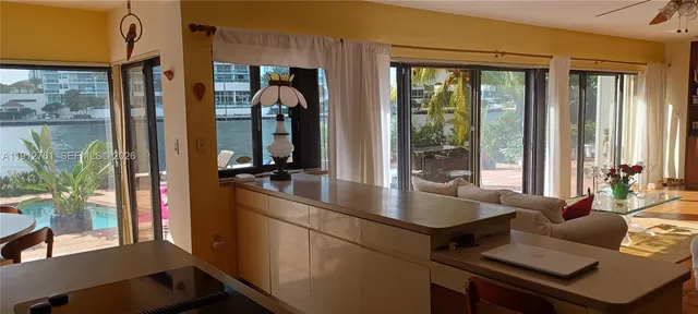 a bathroom with a shower sink vanity granite and mirror
