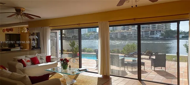 a view of ocean with a tall building