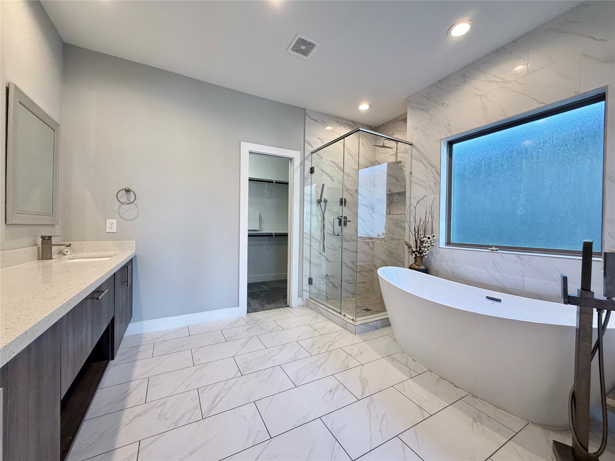 8404 Safeguard Street Houston, TX 77051 - Photo 14 of 25 Worries stop here. Unwind in this primary bath made to melt your problems away