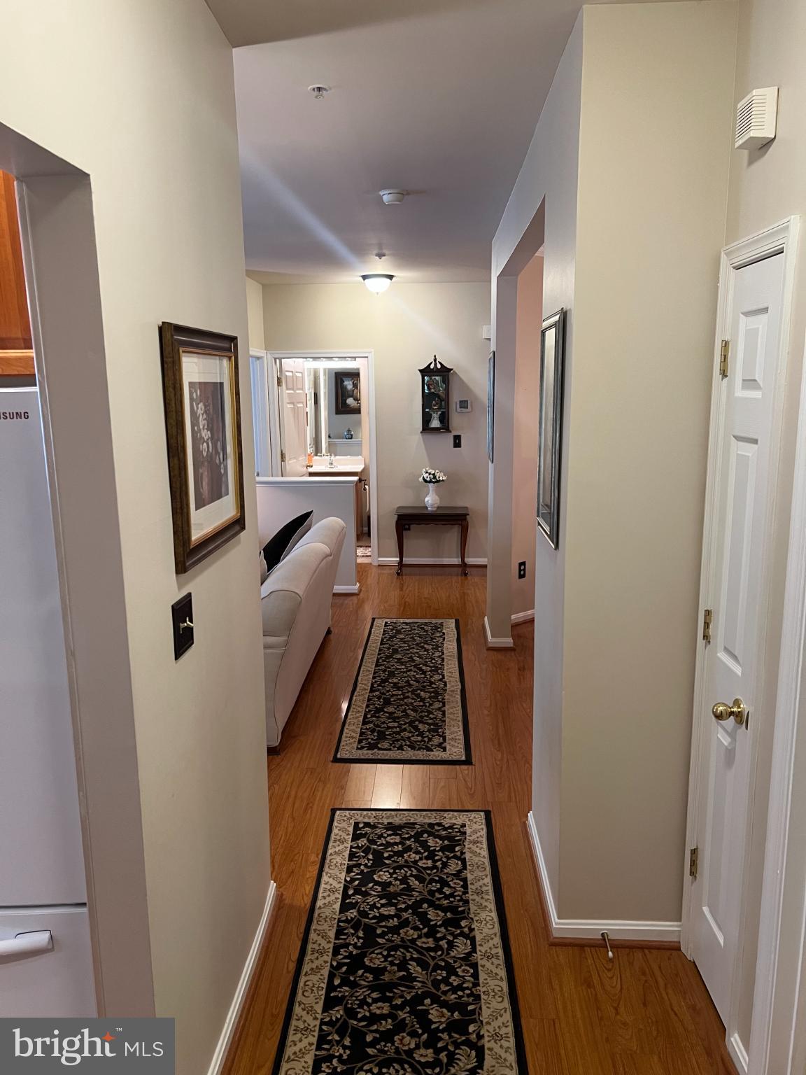 425 Hopkins Landing Drive, Unit 425 Baltimore, MD 21221 - Photo 17 of 43 a walk in closet with wooden floor and a rug