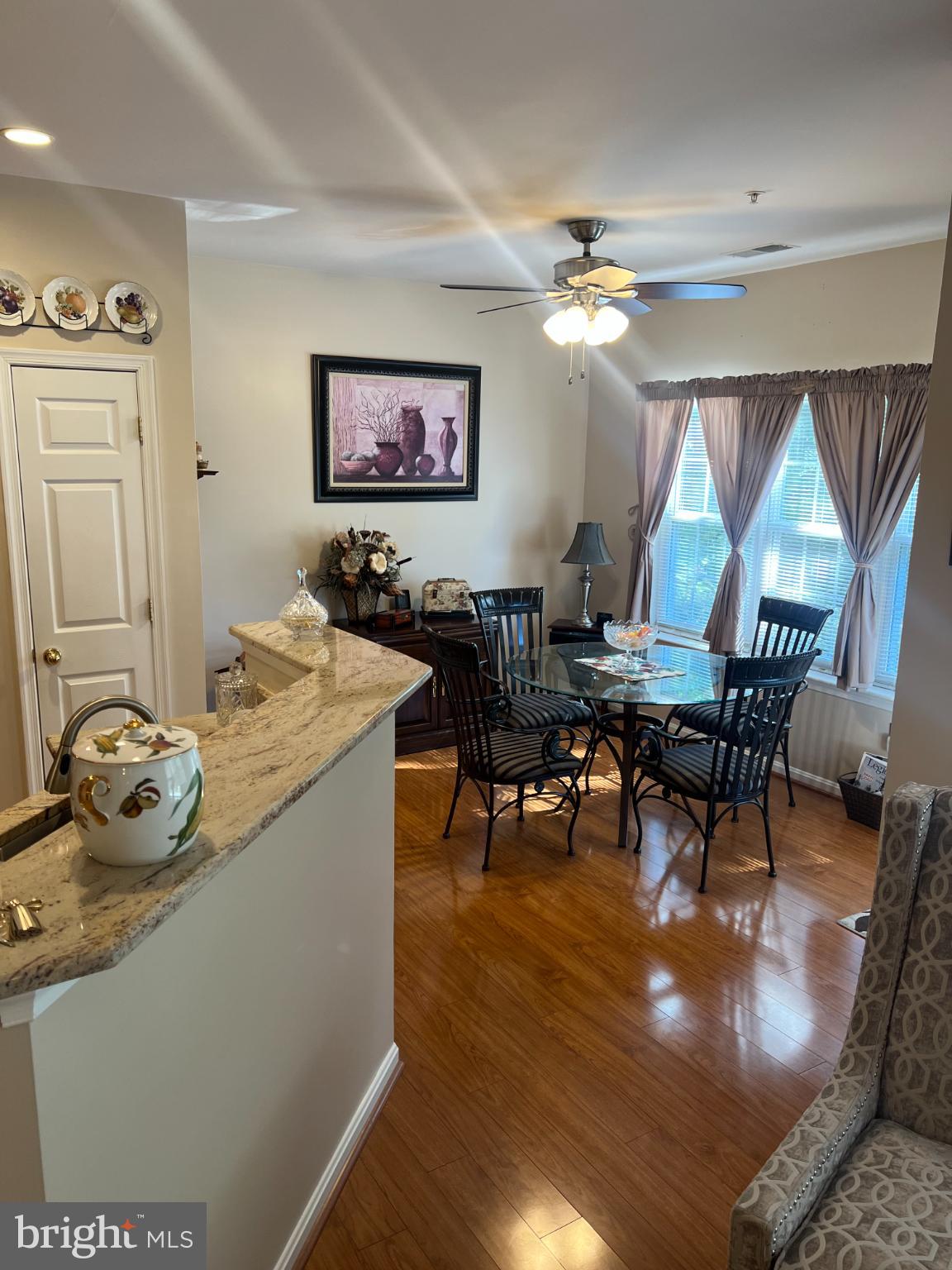 425 Hopkins Landing Drive, Unit 425 Baltimore, MD 21221 - Photo 19 of 43 a living room with furniture and a chandelier