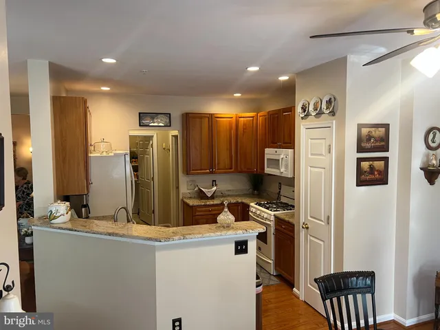 a kitchen with refrigerator and sink
